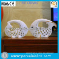 white fish shaped hollow out ceramic backdrop wedding decoration